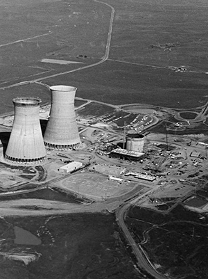 Aerial view of the Rancho Seco Nuclear Power Plant, with two cooling towers to the left and various small buildings to the right.